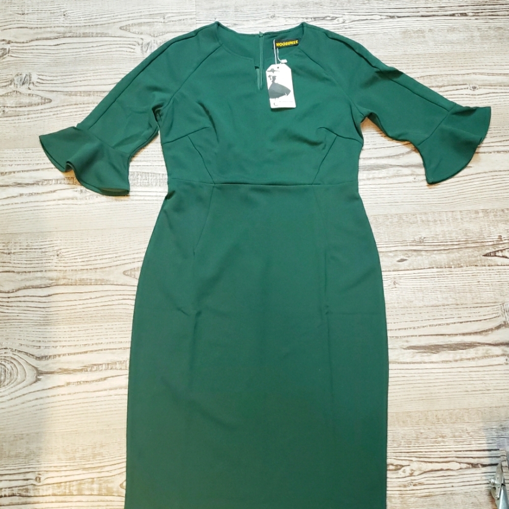 Green dress with bell shaped sleeve, 24 inches from waist to hem.
